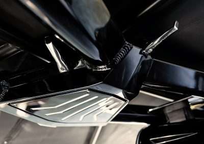 Close-up of motorcycle exhaust and chrome detailing