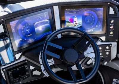 Modern boat cockpit with digital displays and steering wheel