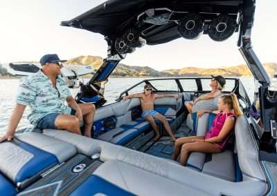 Family enjoying a sunny Orlando boat ride adventure with Freedom Wake Park