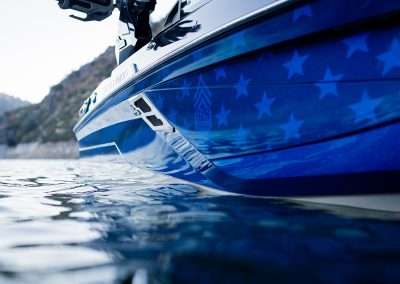 Blue star-patterned boat floating on calm water