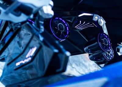 Futuristic car undercarriage with glowing blue lights