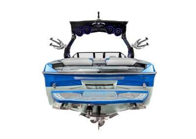Custom blue wakeboarding boat with speakers and racks